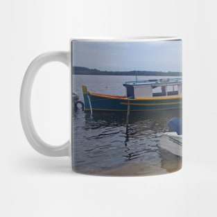 Boats in the lagoon on a cloudy day Mug